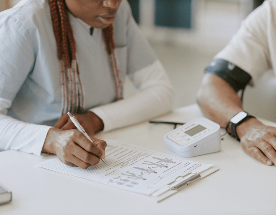 Person reviewing medication and health notes at home