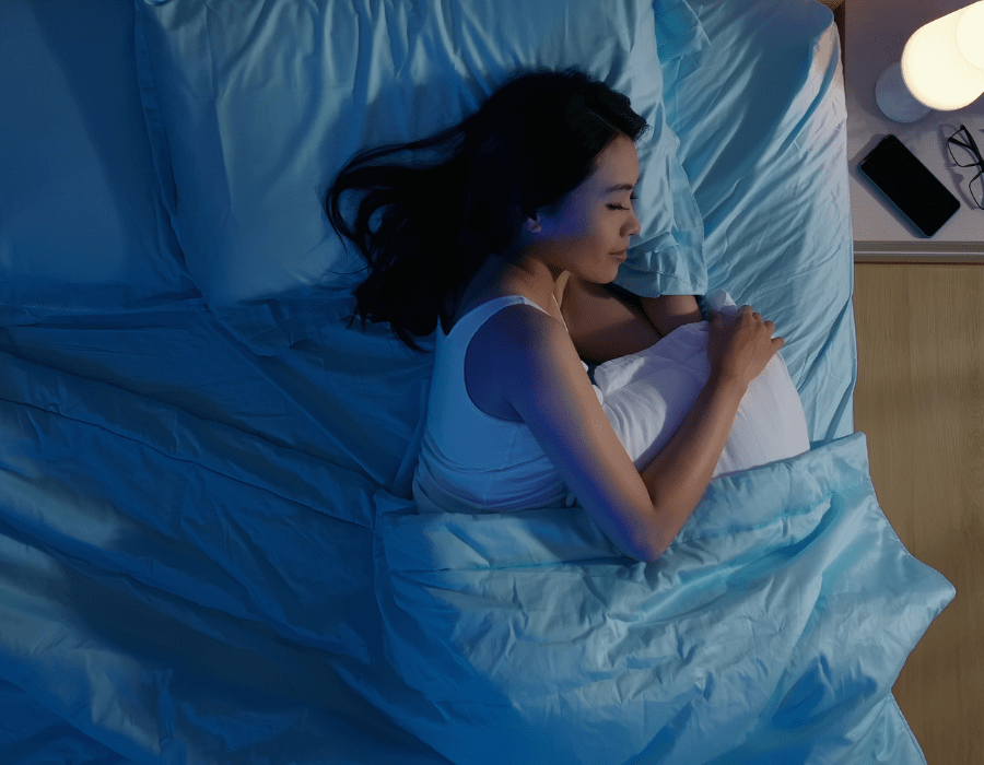 Person waking up rested, sunlight streaming into a calm bedroom